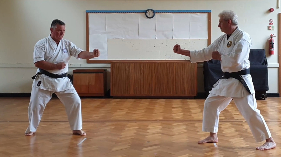 Tori applies final control and pushes Uke away