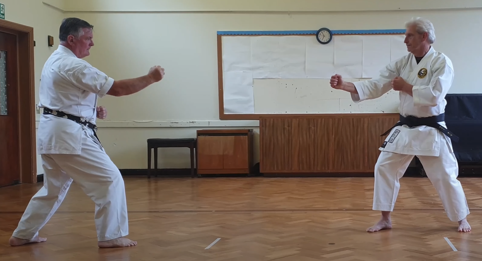 Tori withdraws with Sugi Ashi Kōtai into Hanmi Gamae after Kumite Kata No.2